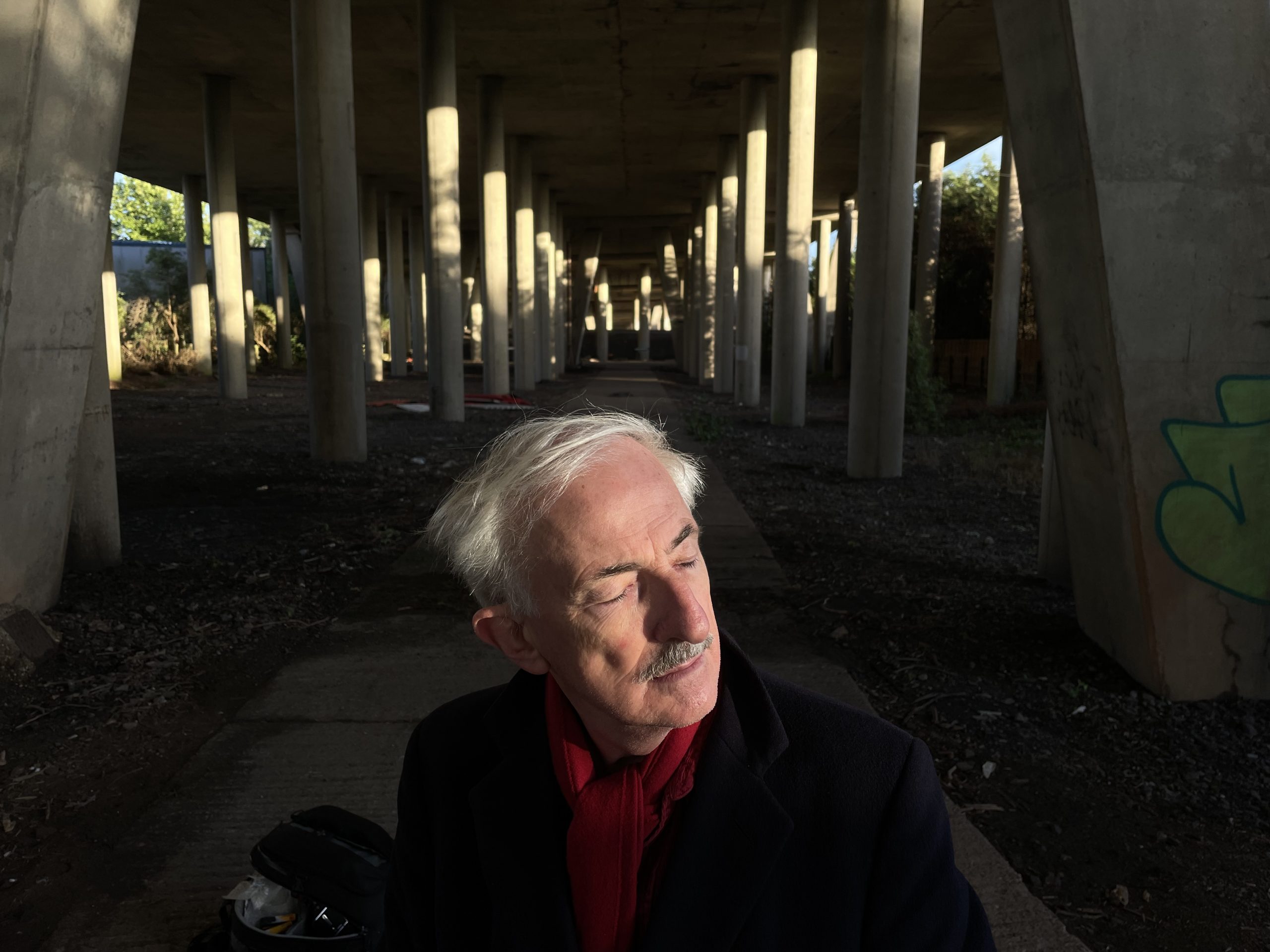 Close up of a man, on his own underneath and underpass